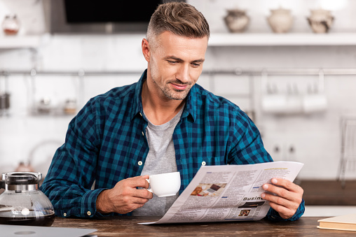 Man reading newspaper