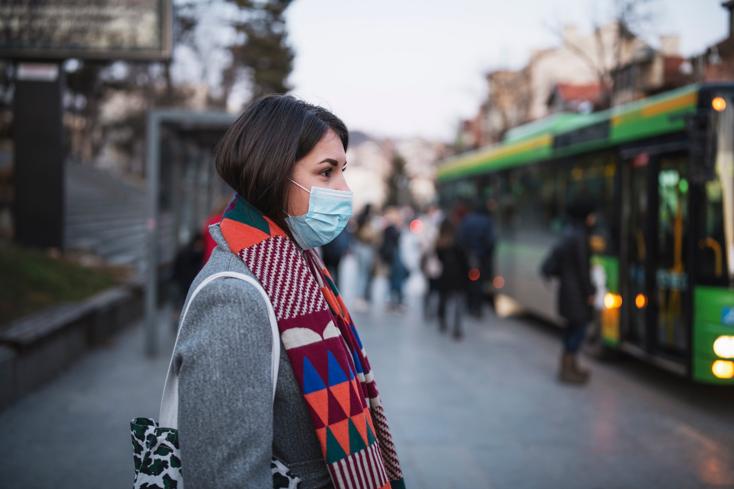 woman in town wearing protective face mask