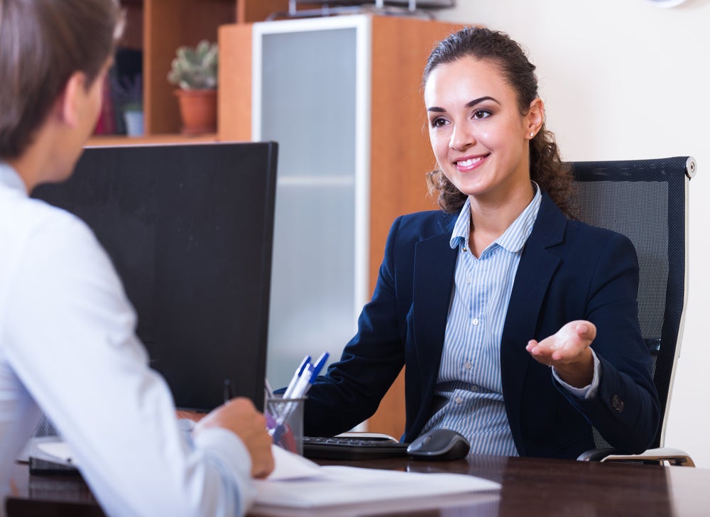 female administrator talking in office