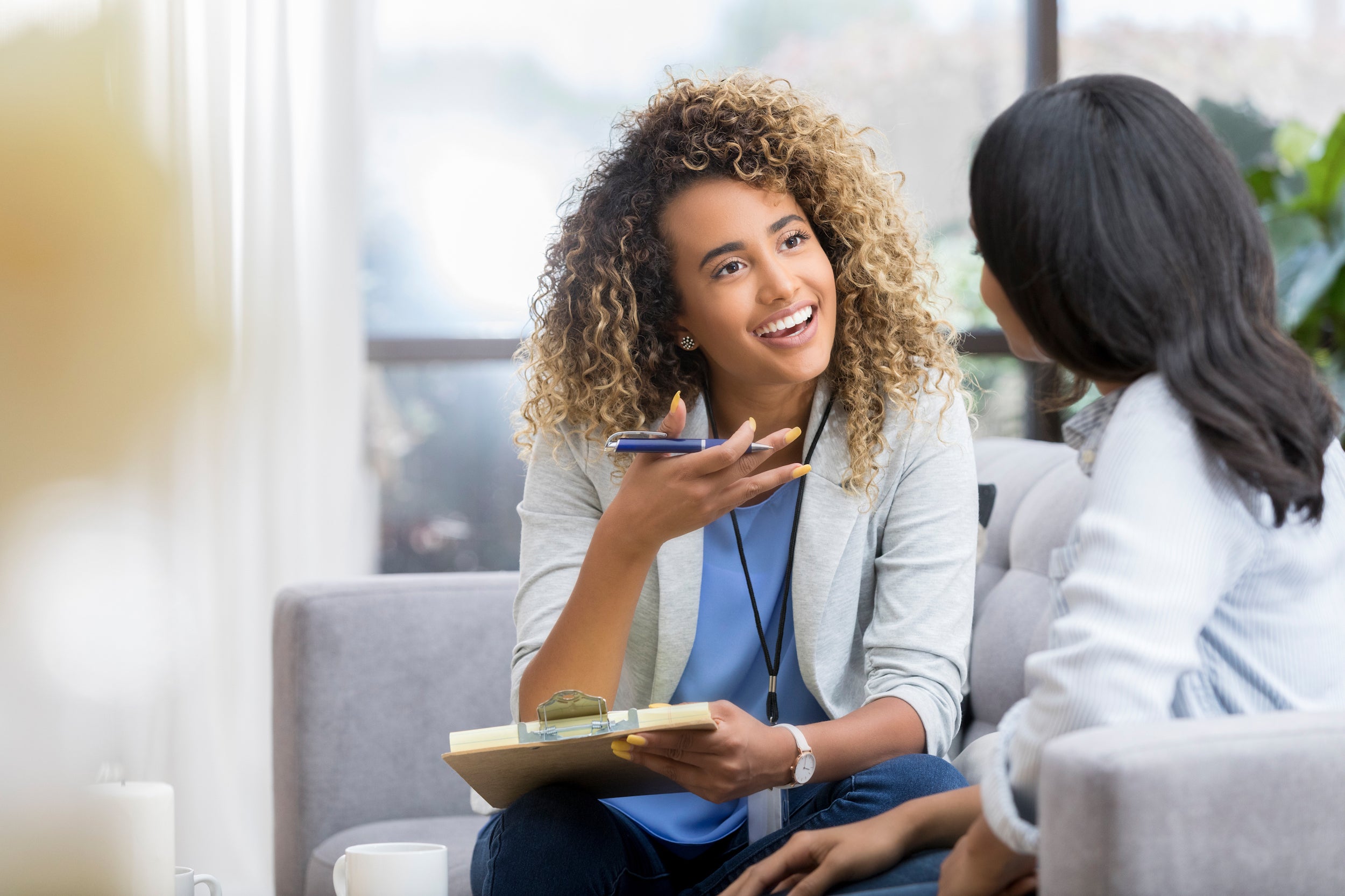 female therapist talks with young woman