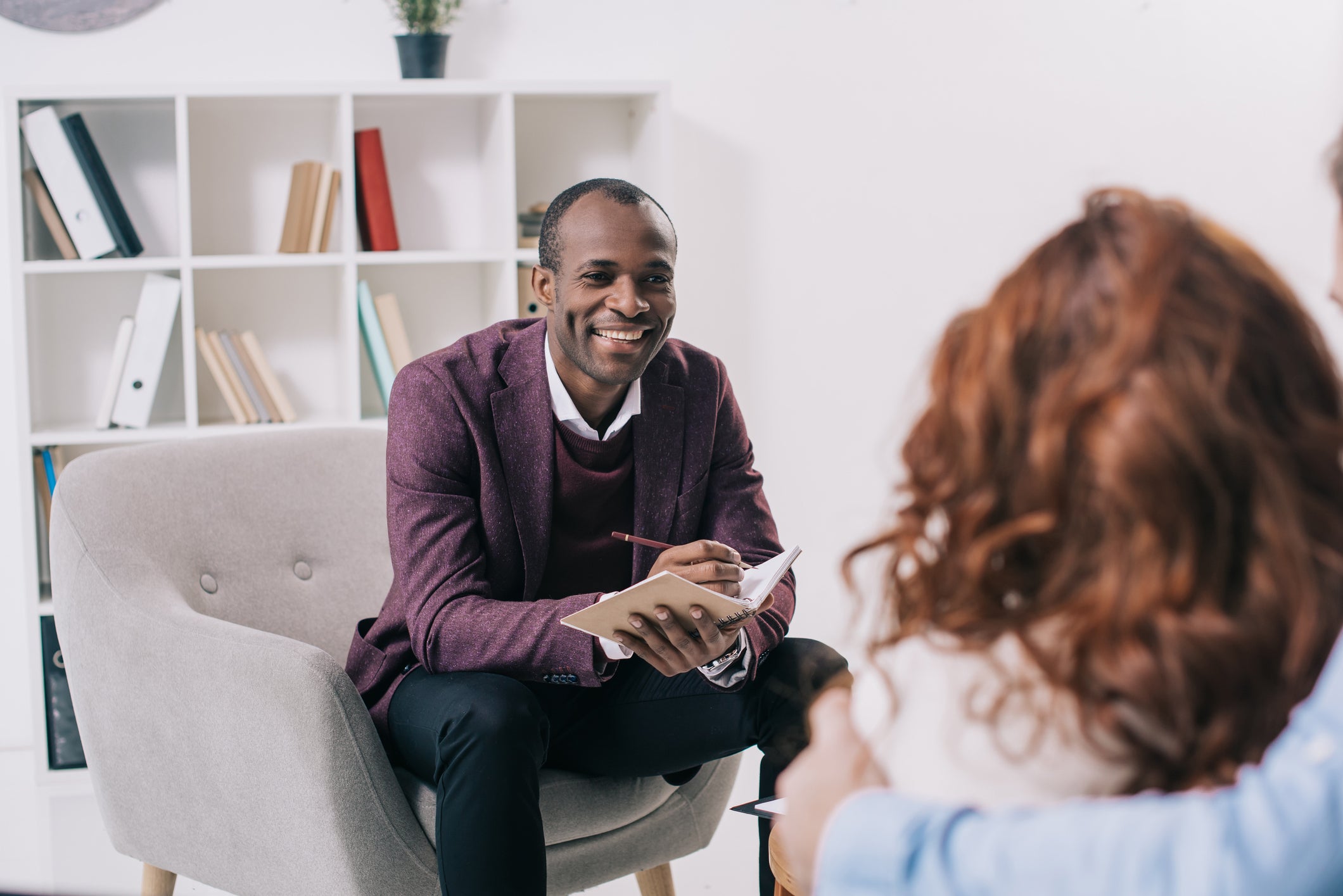 male therapist talking to patient