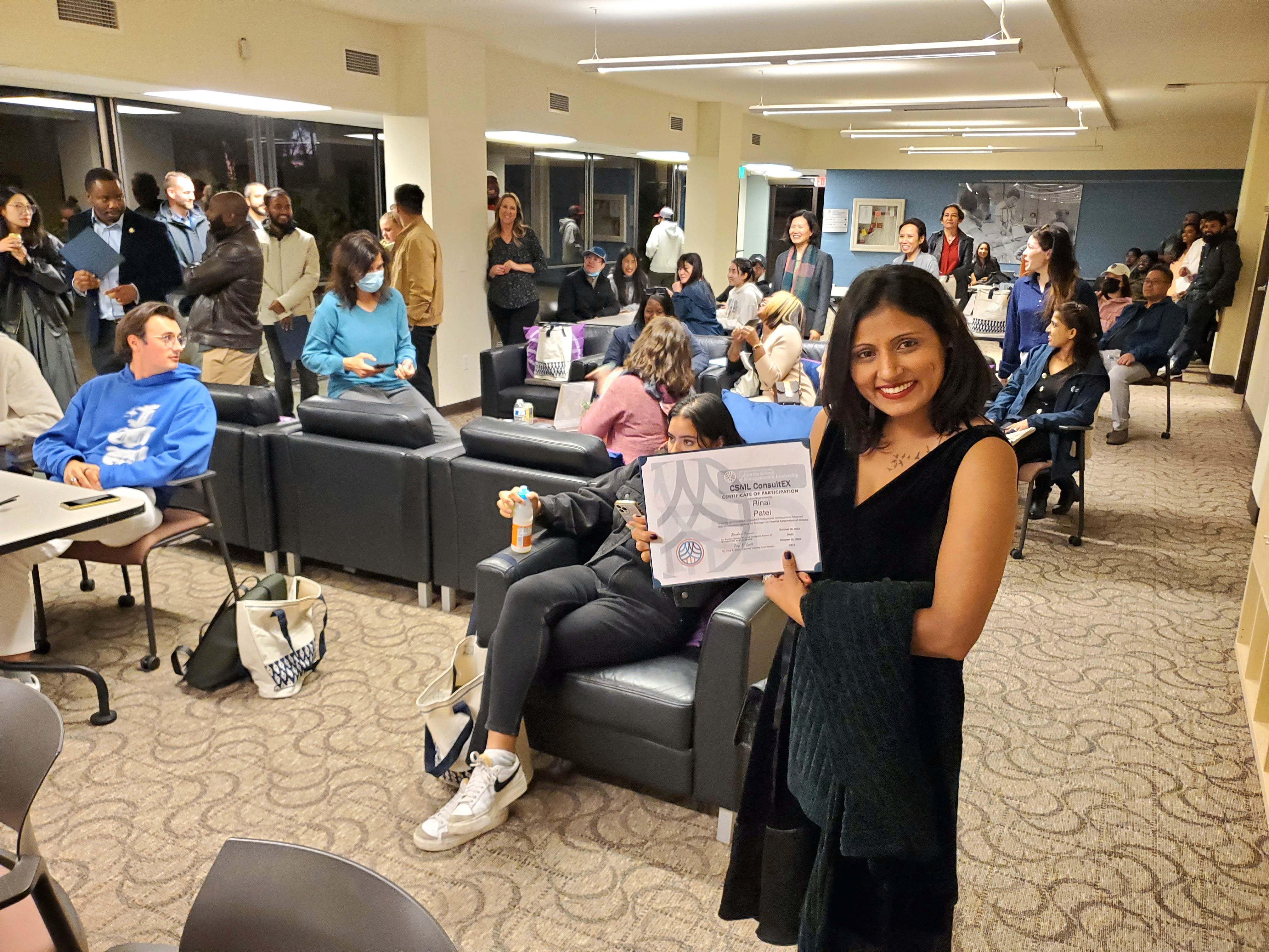 Student holding certificate
