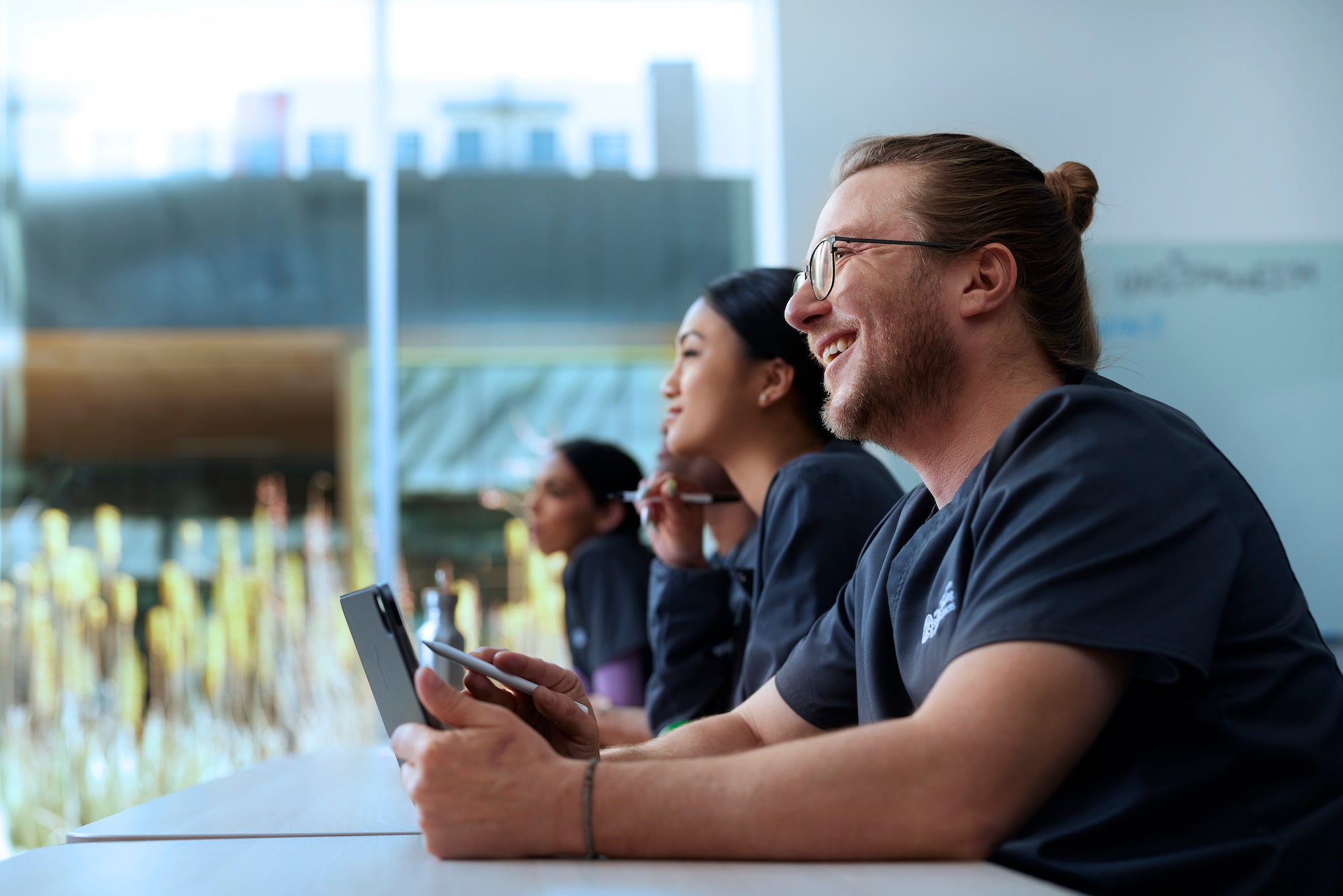 Alliant Nursing Student Holding a Tablet in Class