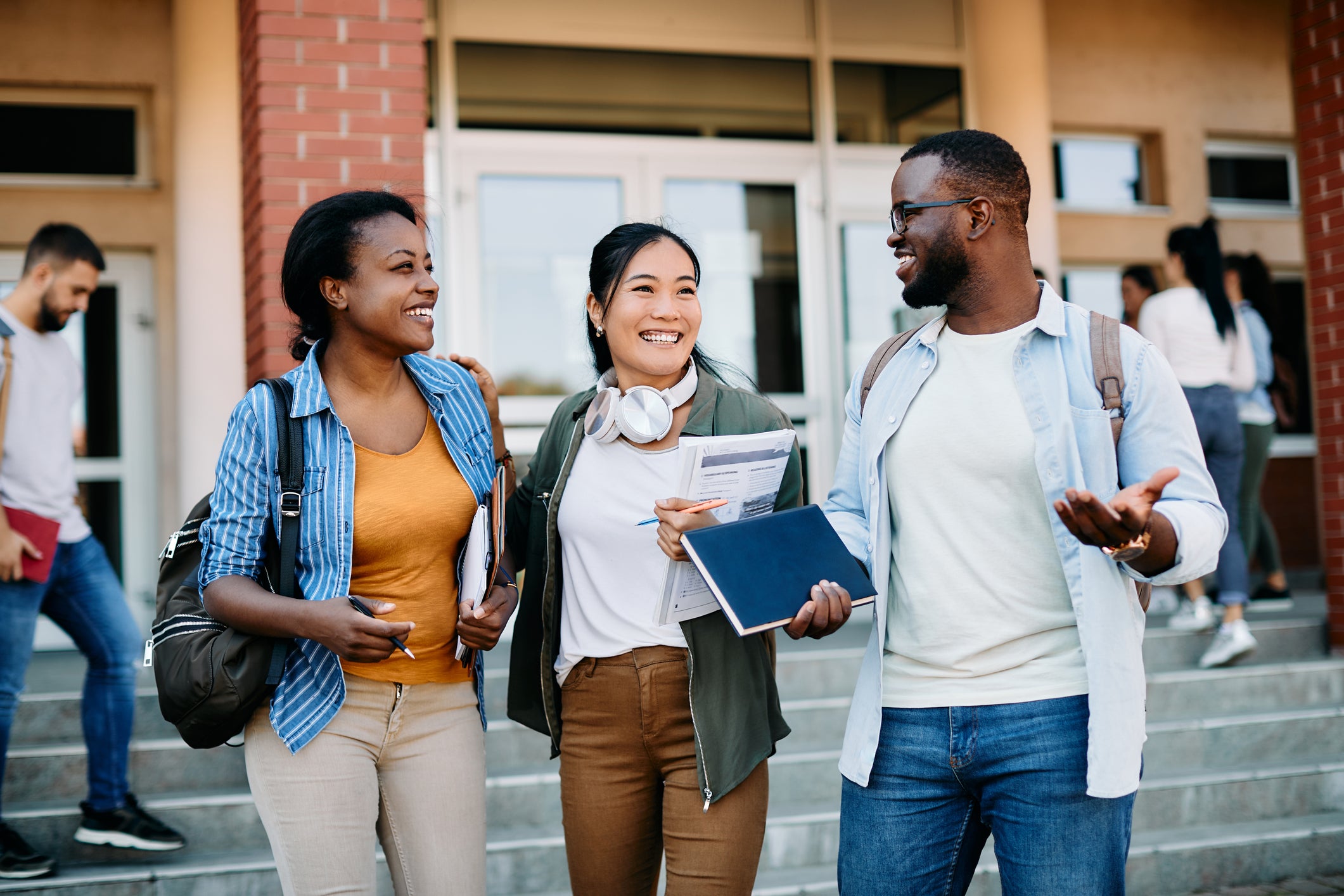 Three Students walking and talking