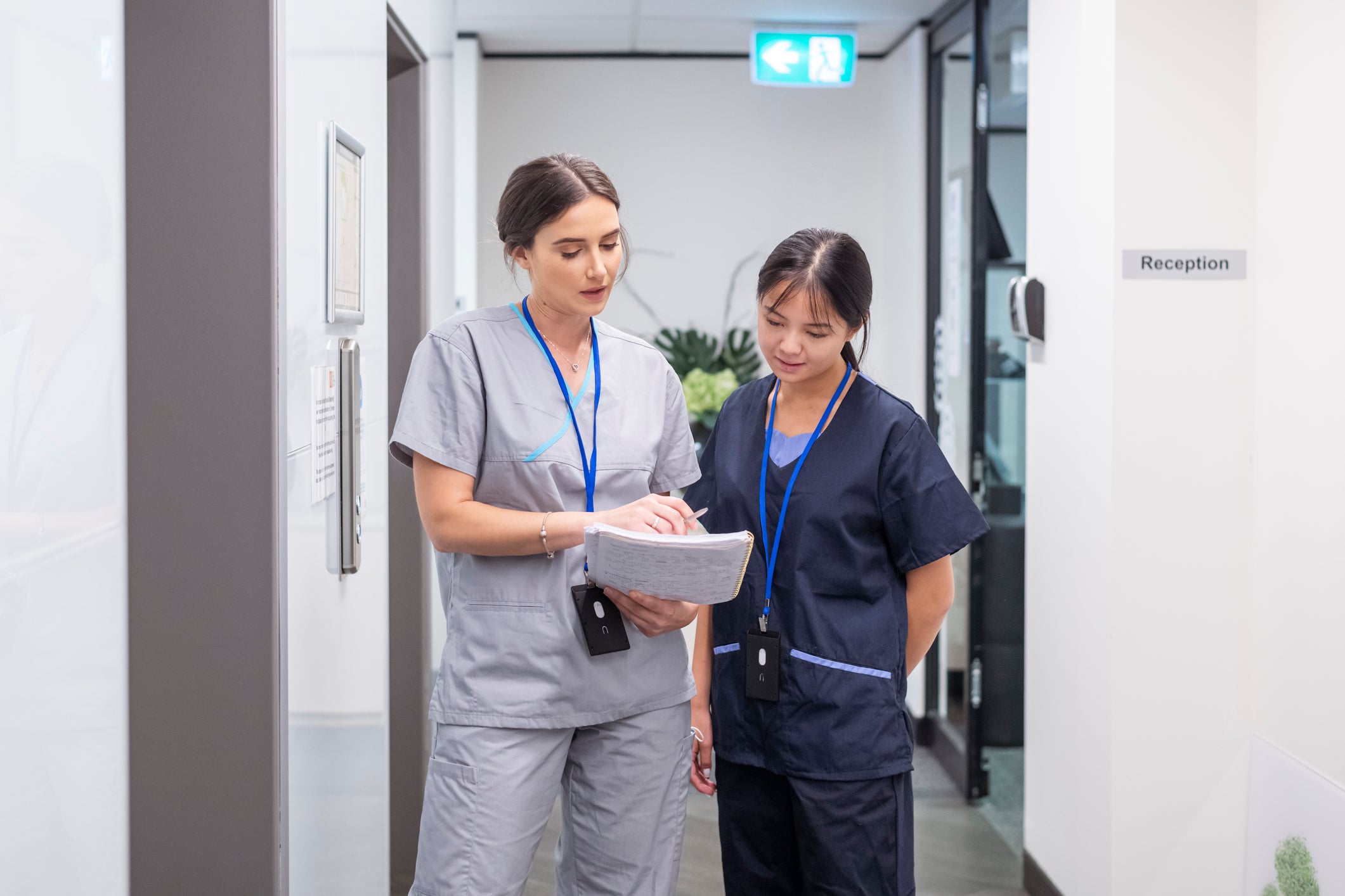 two nurses walking and talking