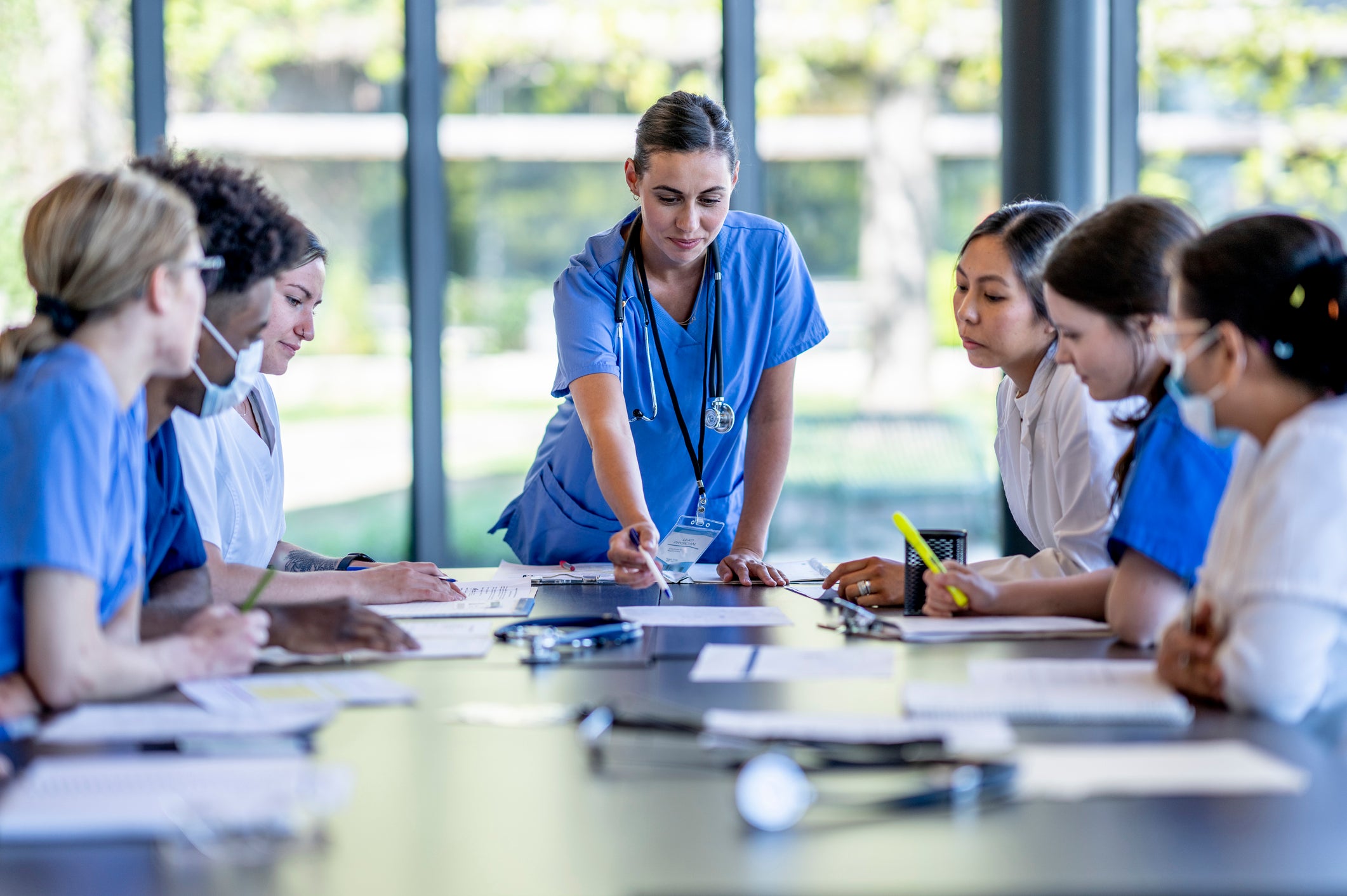 nurse talking to room full of nurses