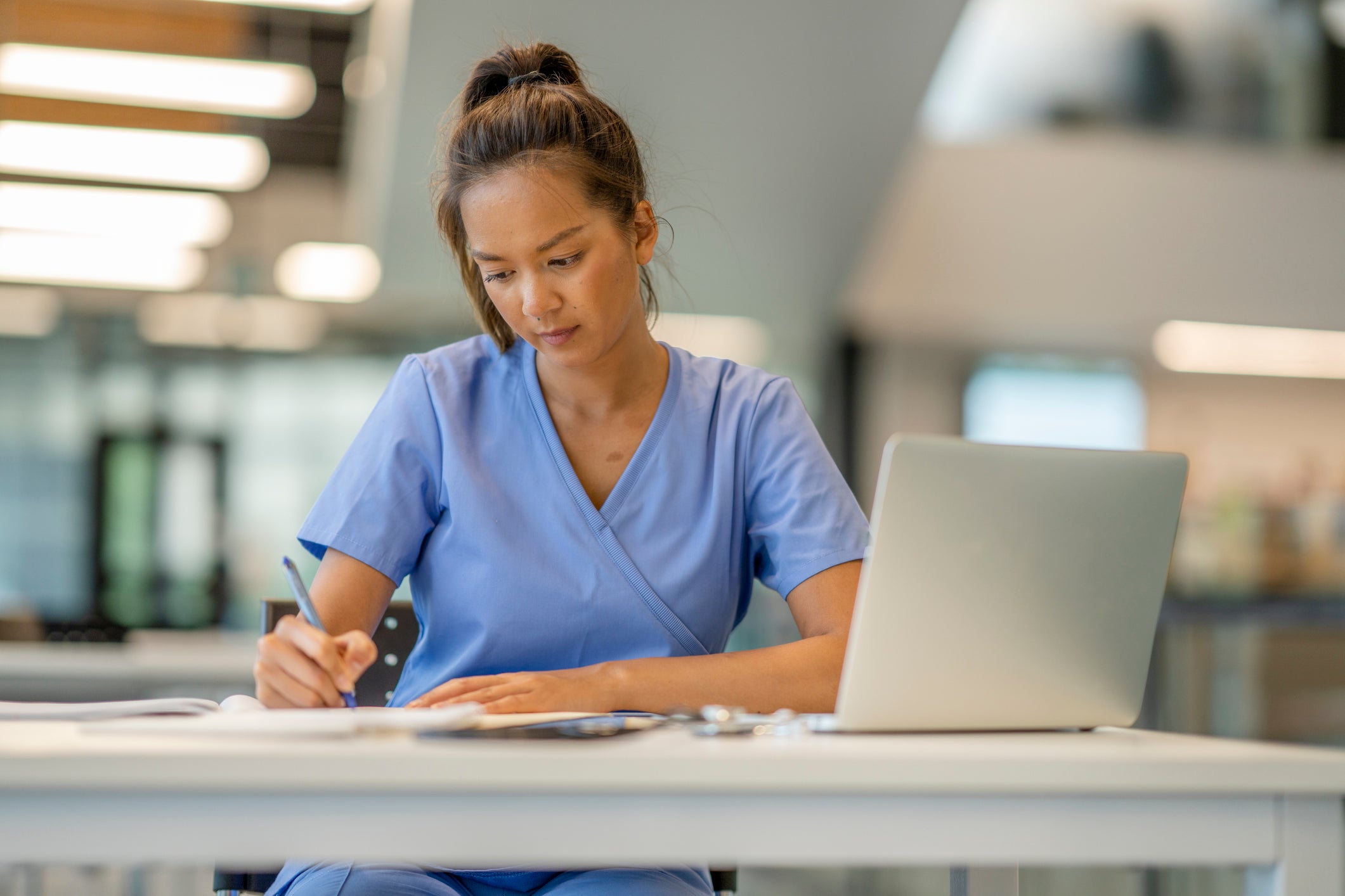 nurse studying at a desk