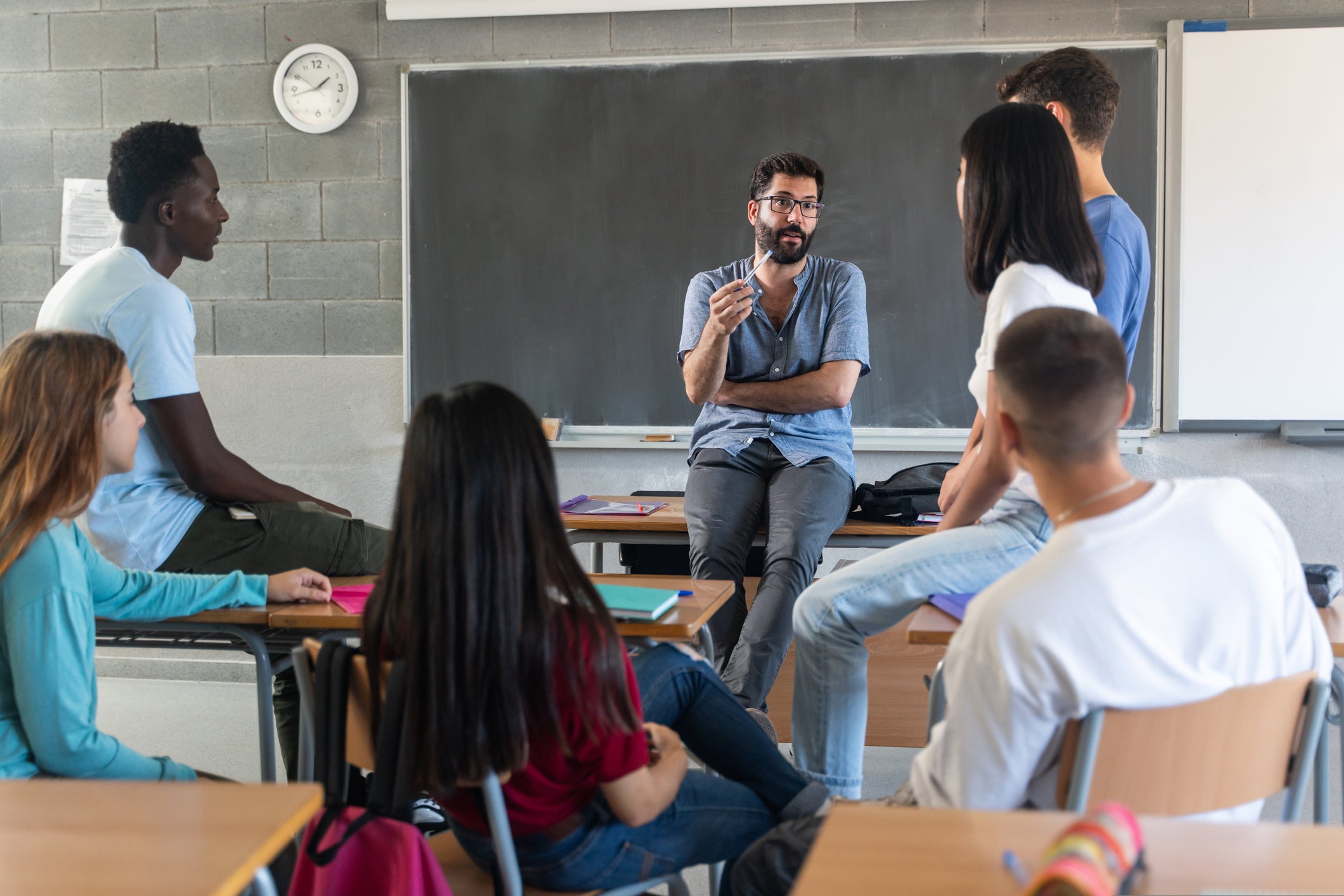 teacher talking to students