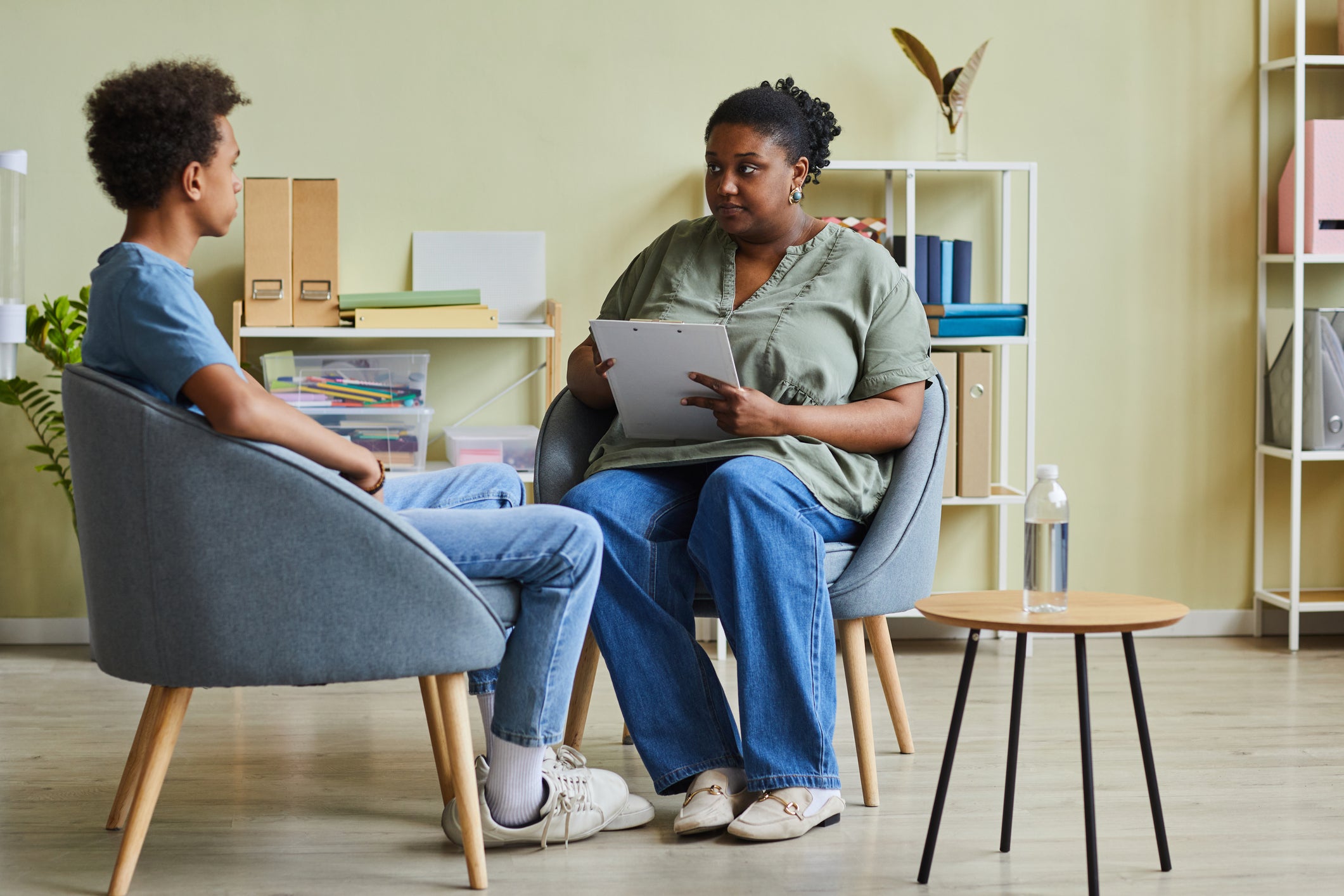 social worker talking to younger man