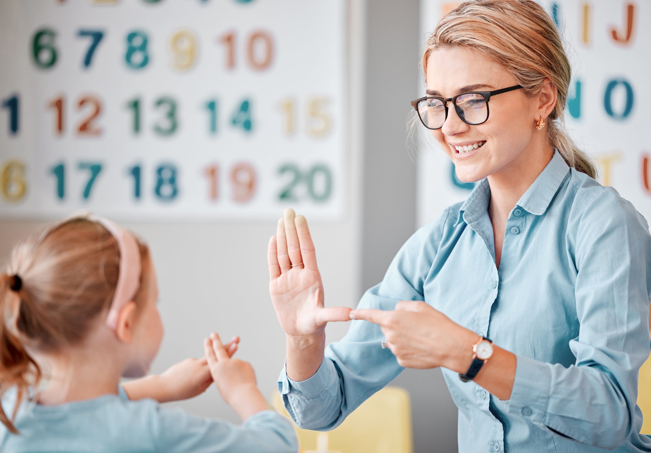 teacher helping student
