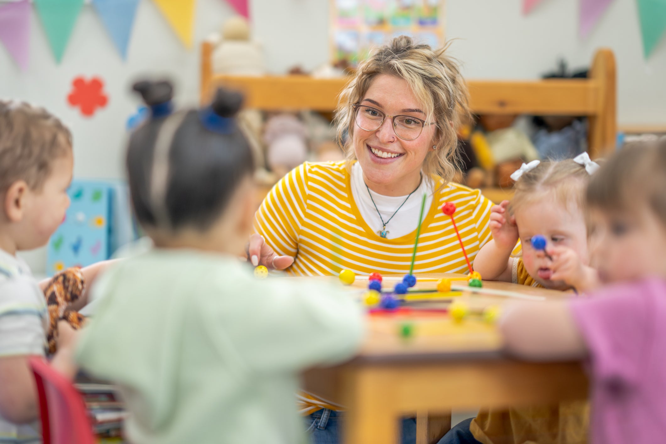 teacher helping students