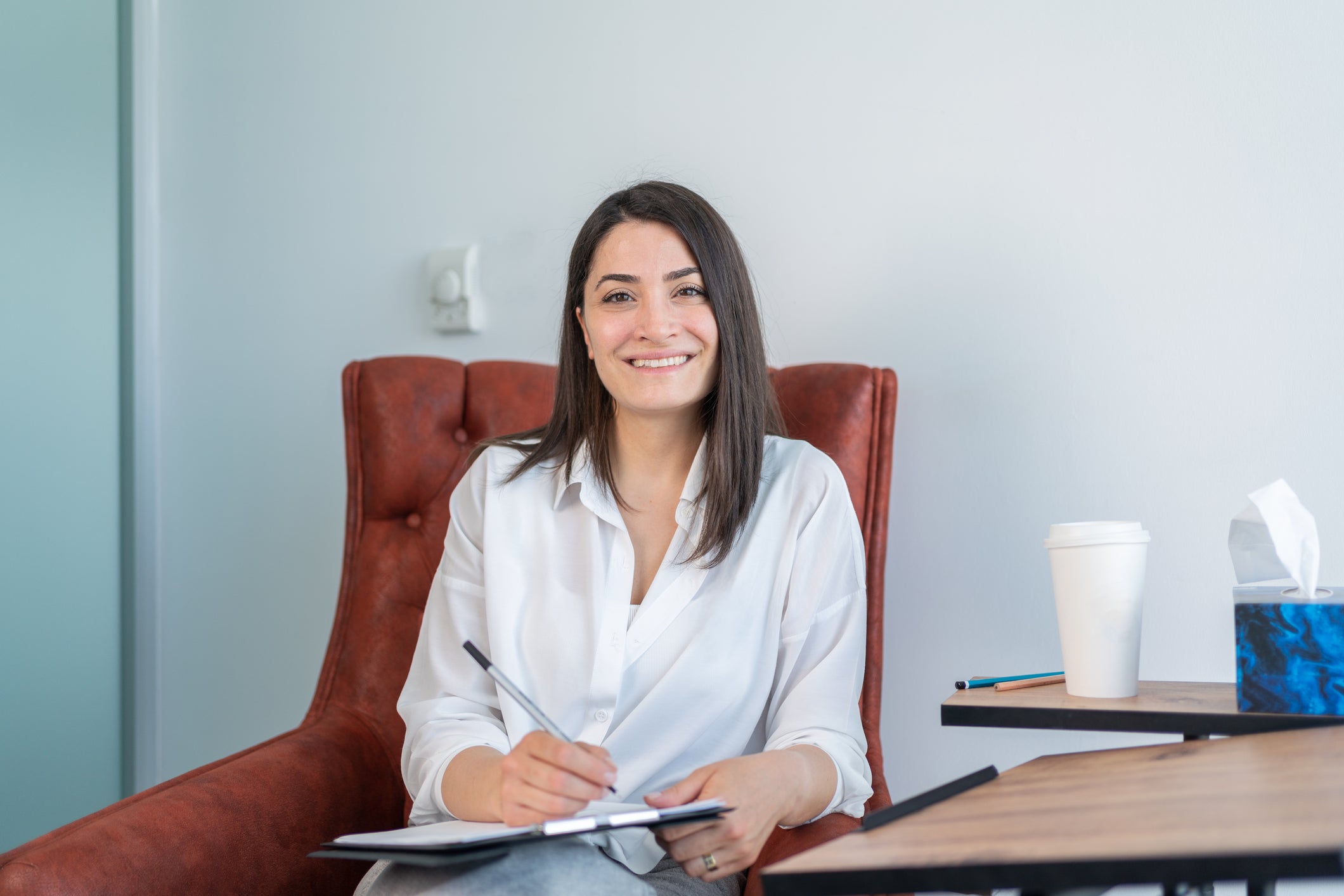 woman psychologist sitting in a chair
