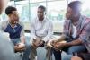 men talking in group session