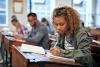 female student taking notes