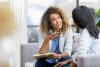 female therapist talks with young woman