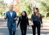 Andy Vaughn walking with students on campus