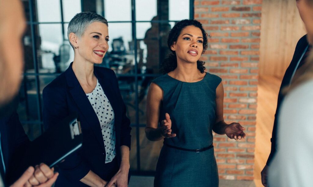 women talking with group