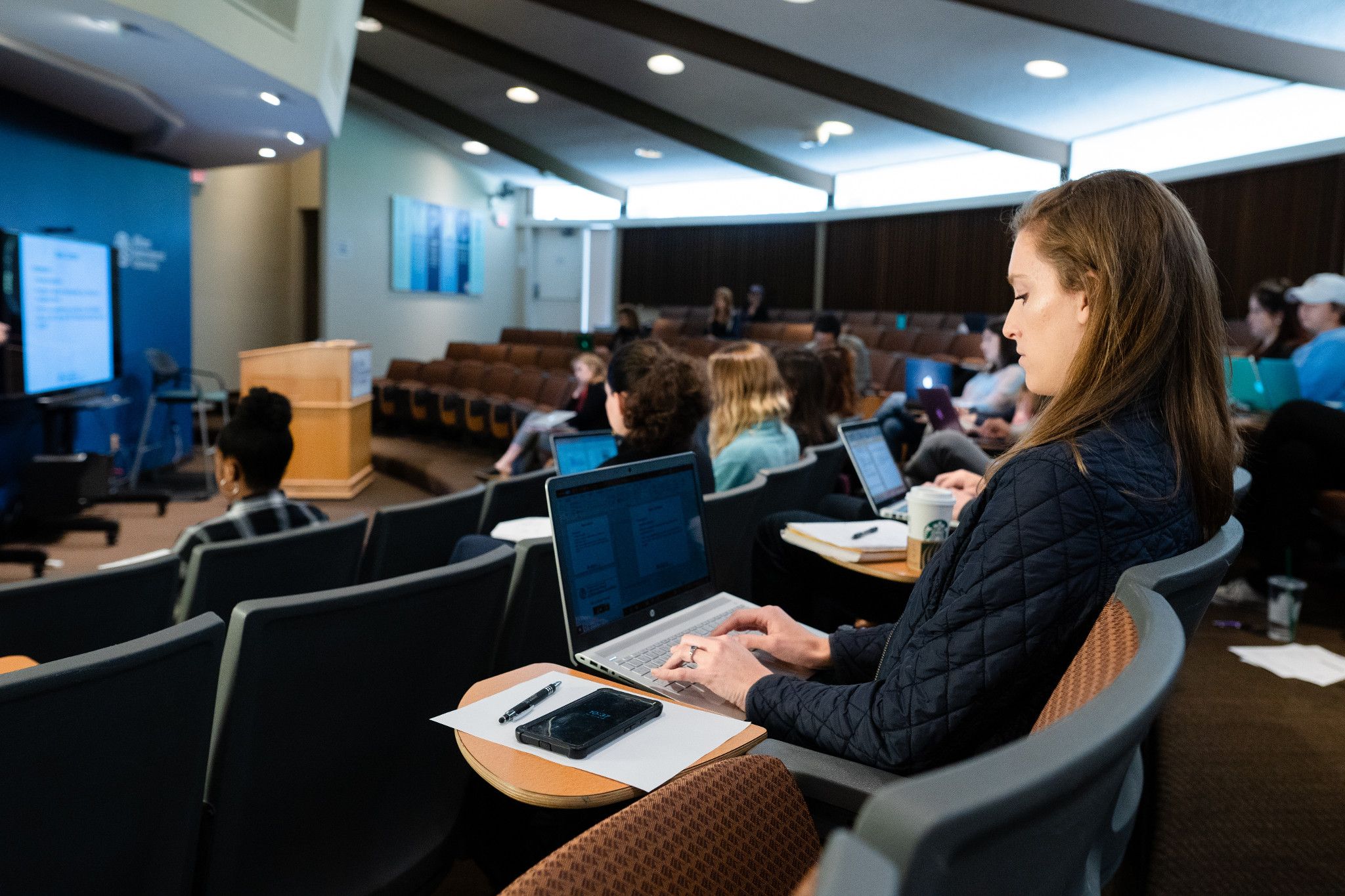 student sitting in lecture-hall
