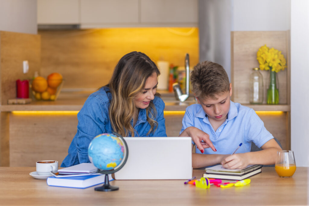 mother helping son with homework