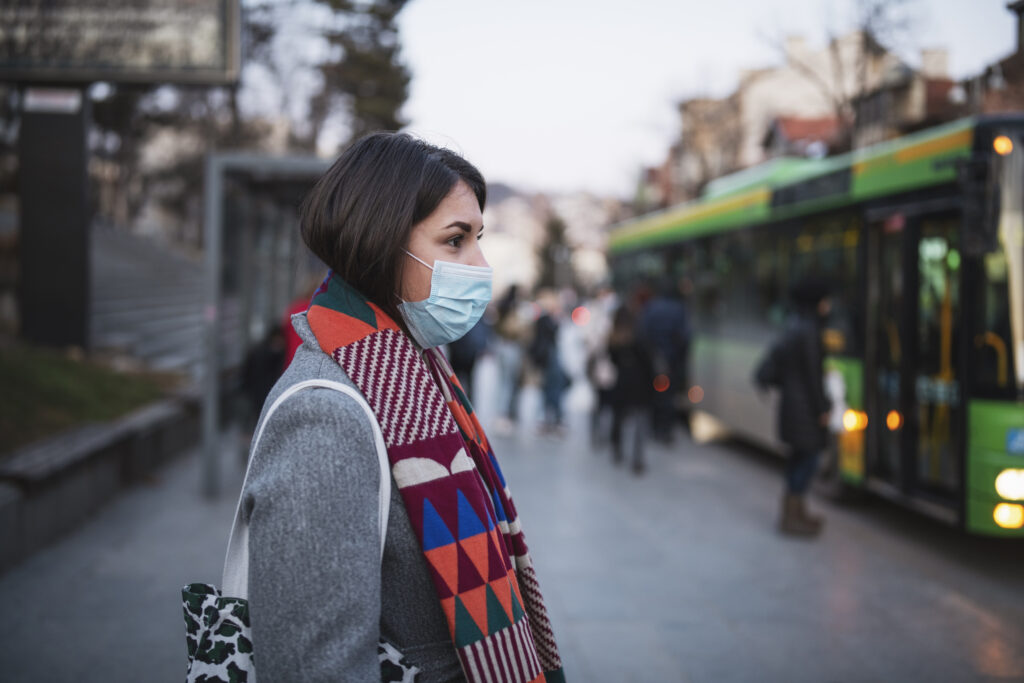 woman in town wearing protective face mask