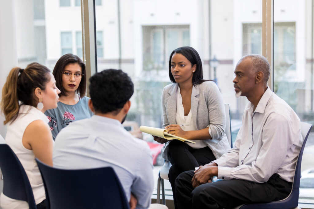 woman listening at team building meeting