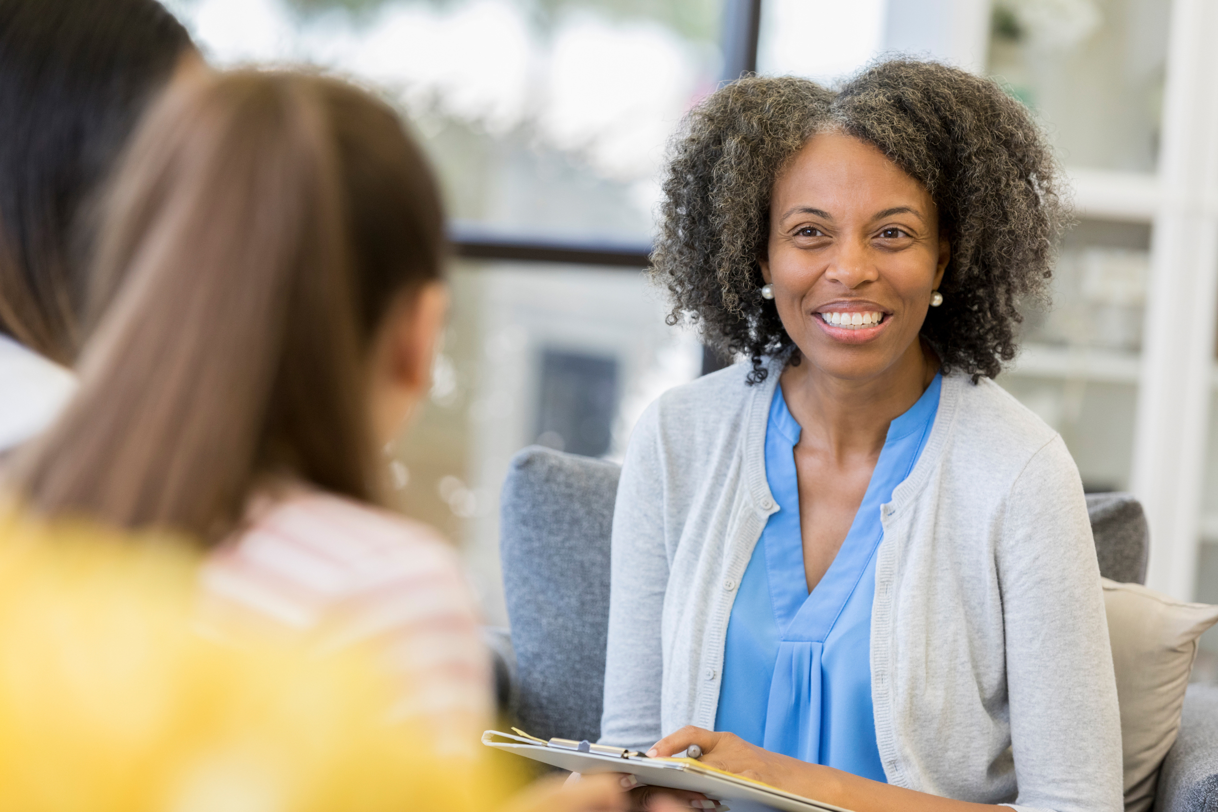 woman guidance counselor talking with students