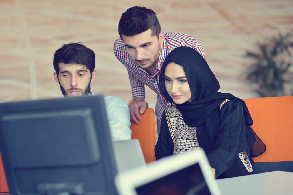 group of students looking at monitor