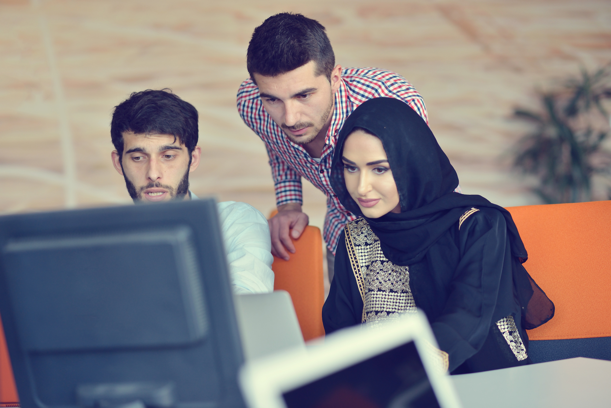 group of students looking at monitor
