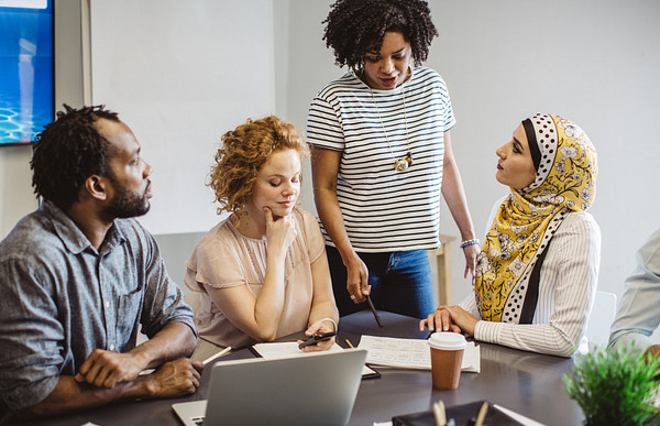 doctorate in educational psychology students discussing together over the table