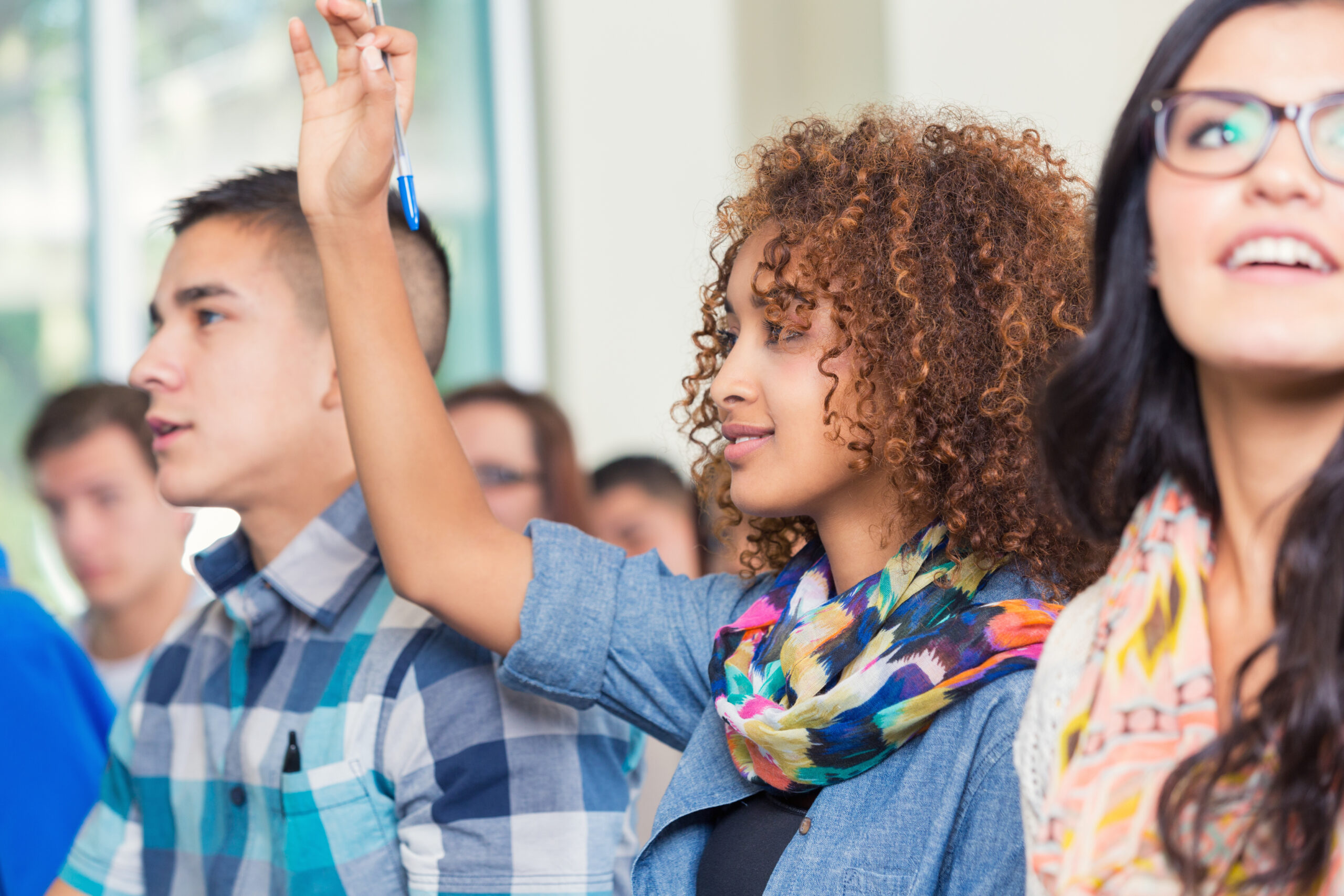 student raising hand
