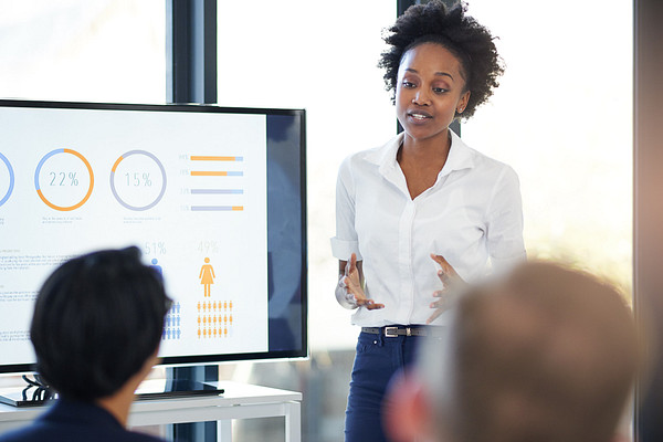 female teacher of PhD in Leadership standing in front of the class