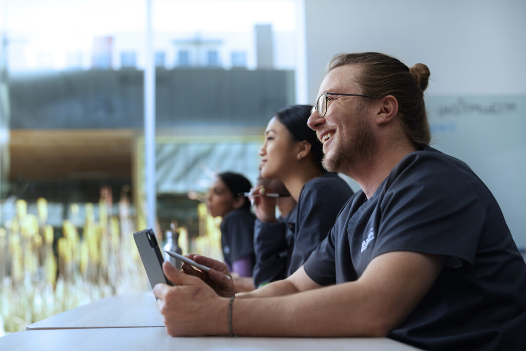 Alliant Nursing Student Holding a Tablet in Class