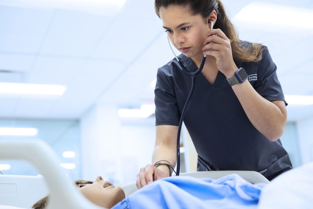 Alliant Nursing Student Listening to Patient's Heartbeat