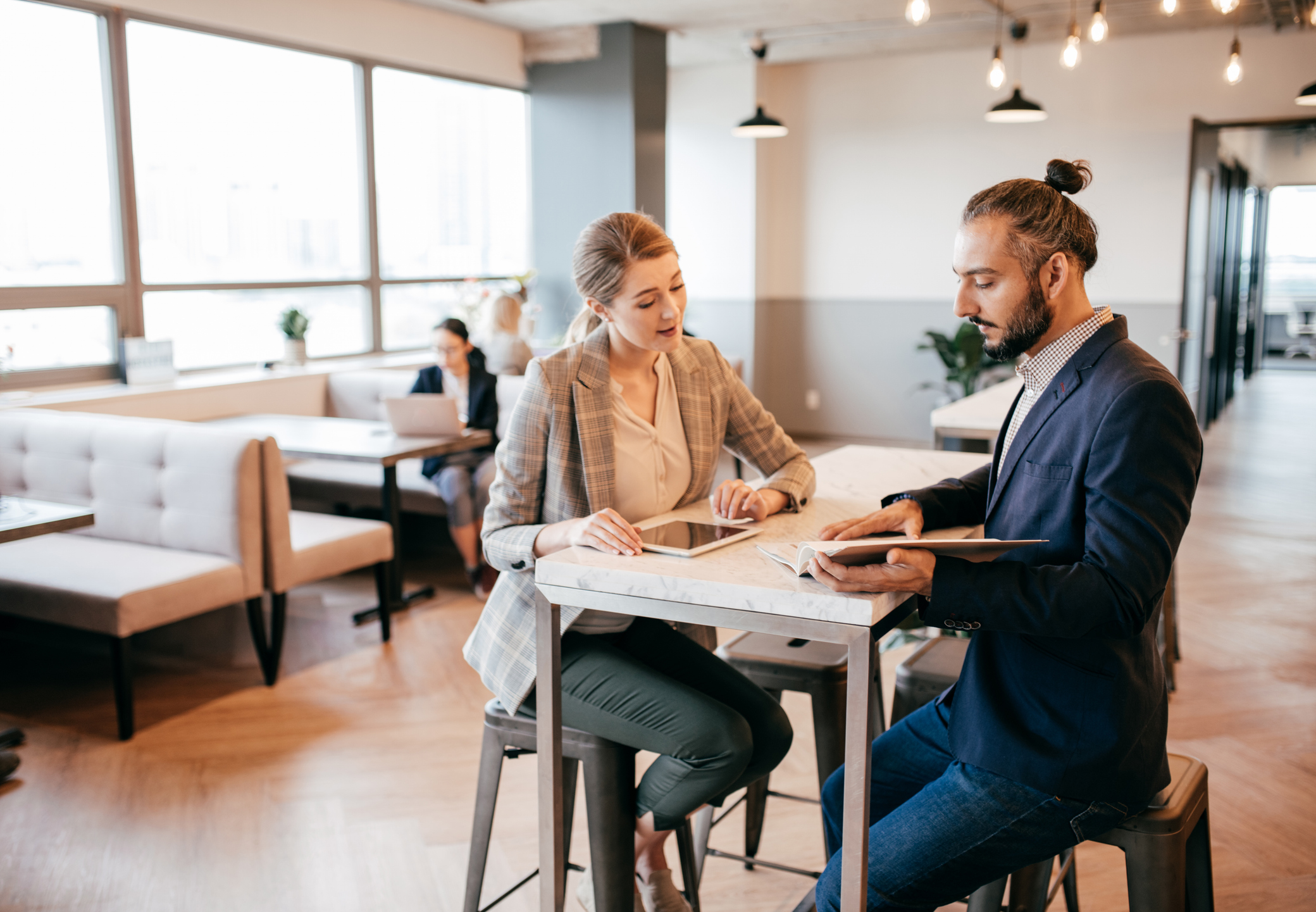 two men talking at the table