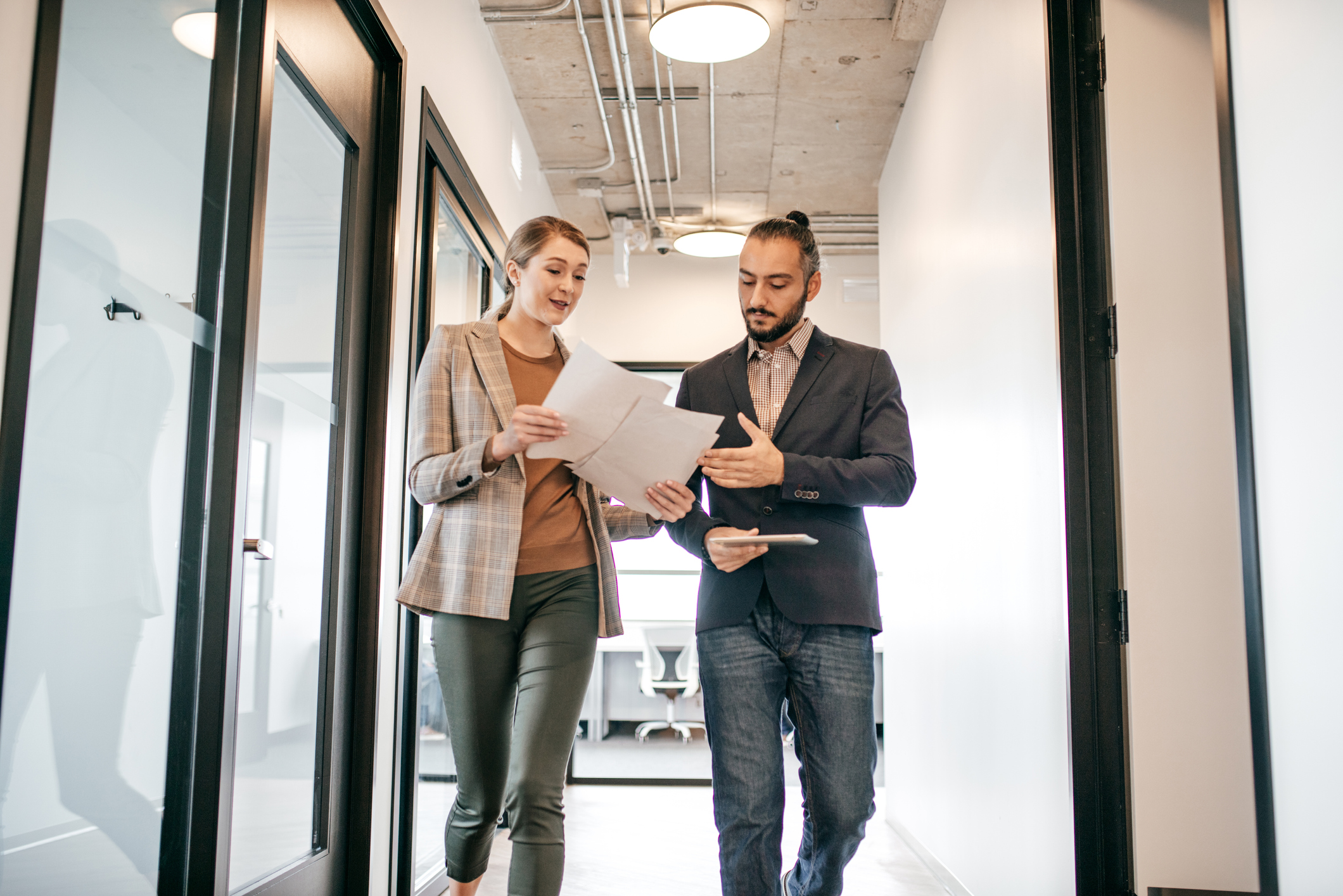 two people talking in hallway