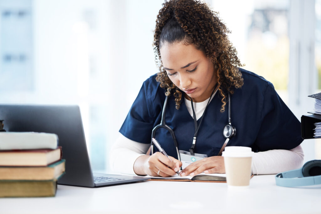 nurse studying at a computer
