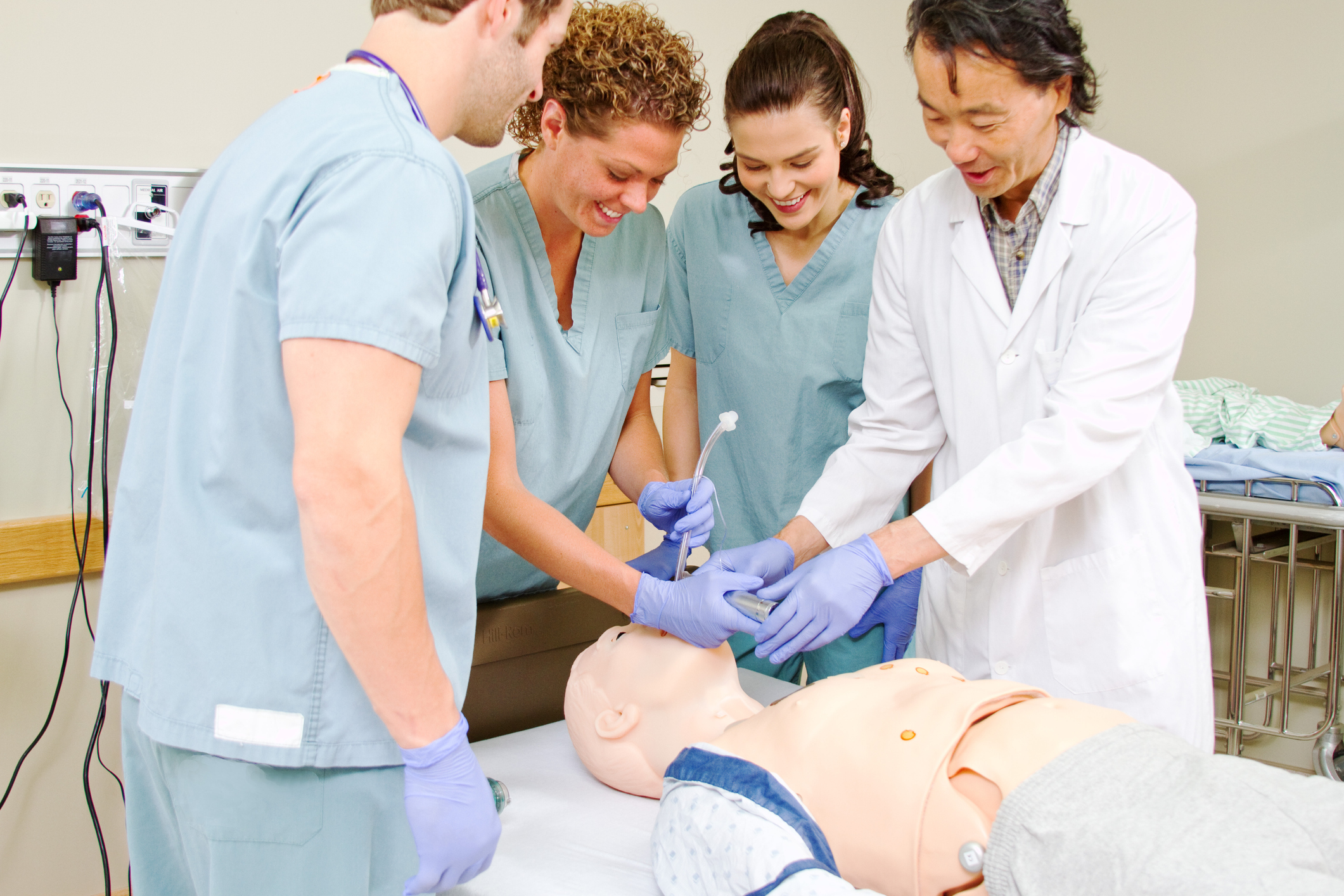 Nurses practicing on dummy
