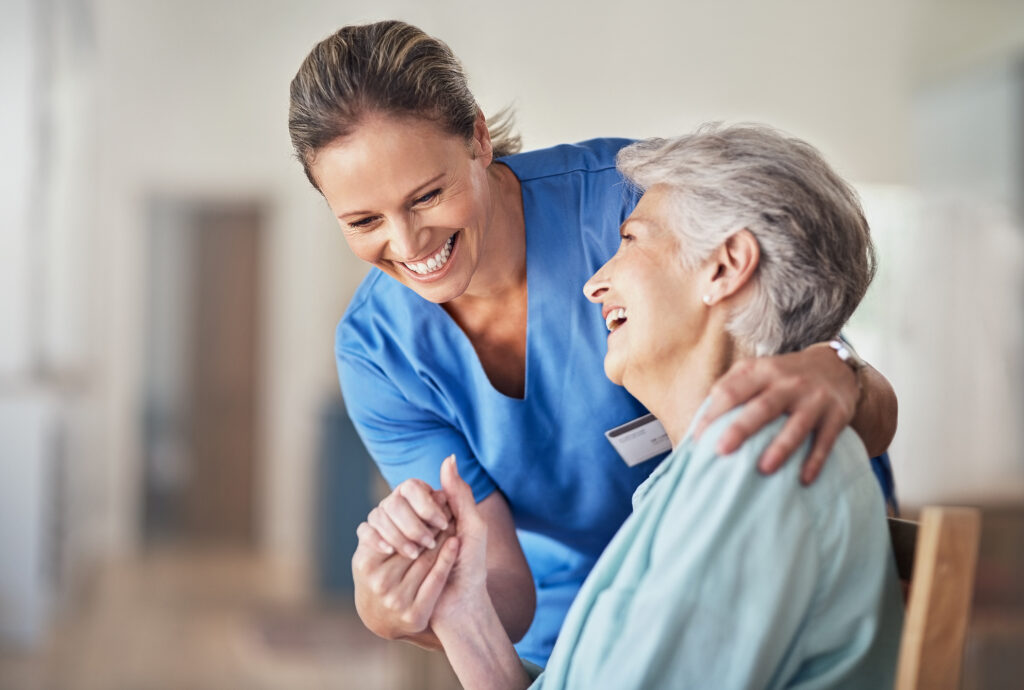 woman holding hands of older woman