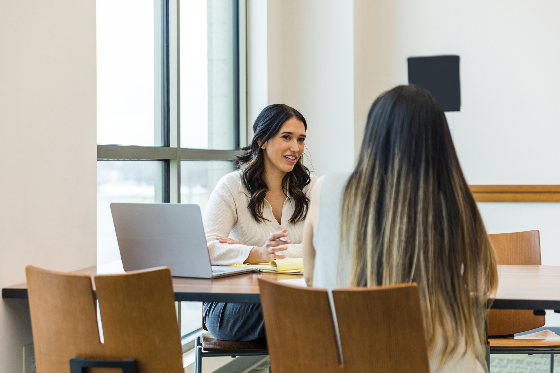 woman talking to another woman