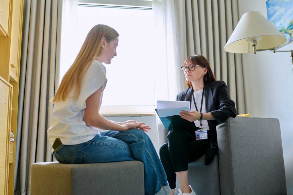 young woman talking to therapist