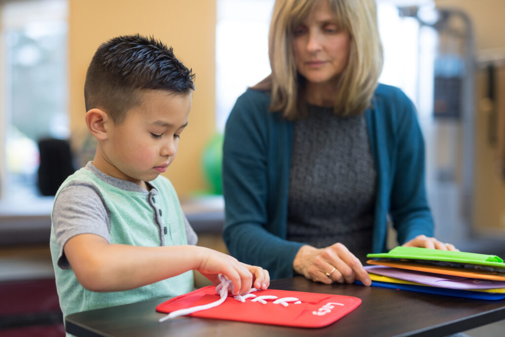therapist helping child