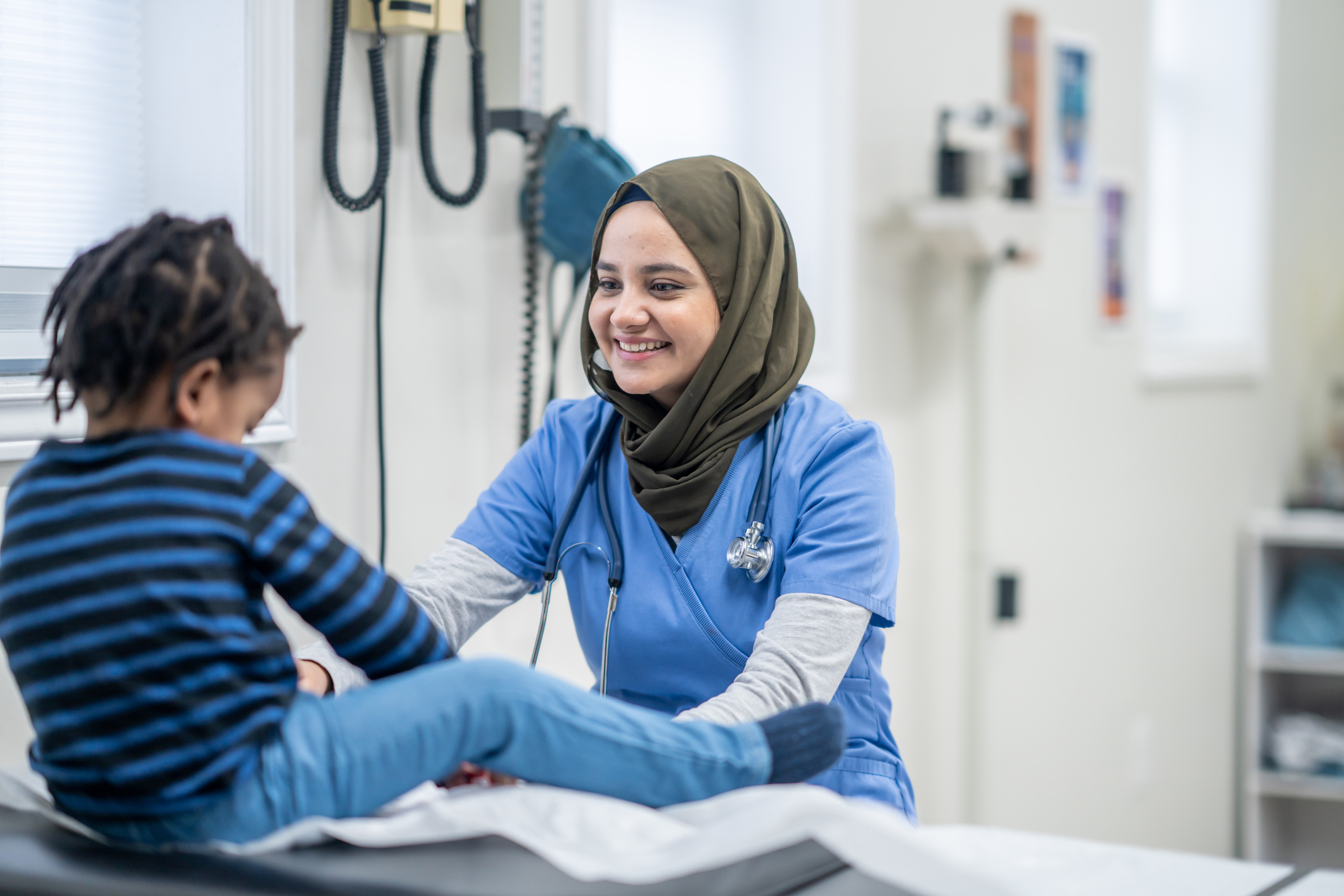 Nurse helping child patient