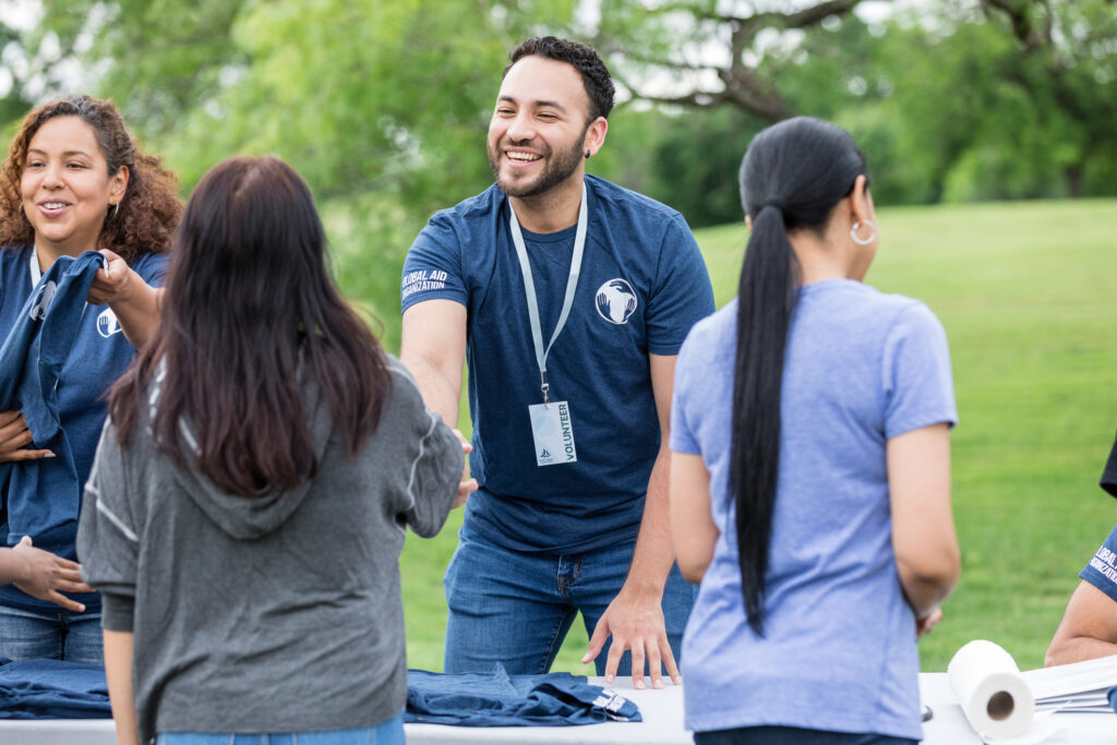 man talking at fair and shaking hand