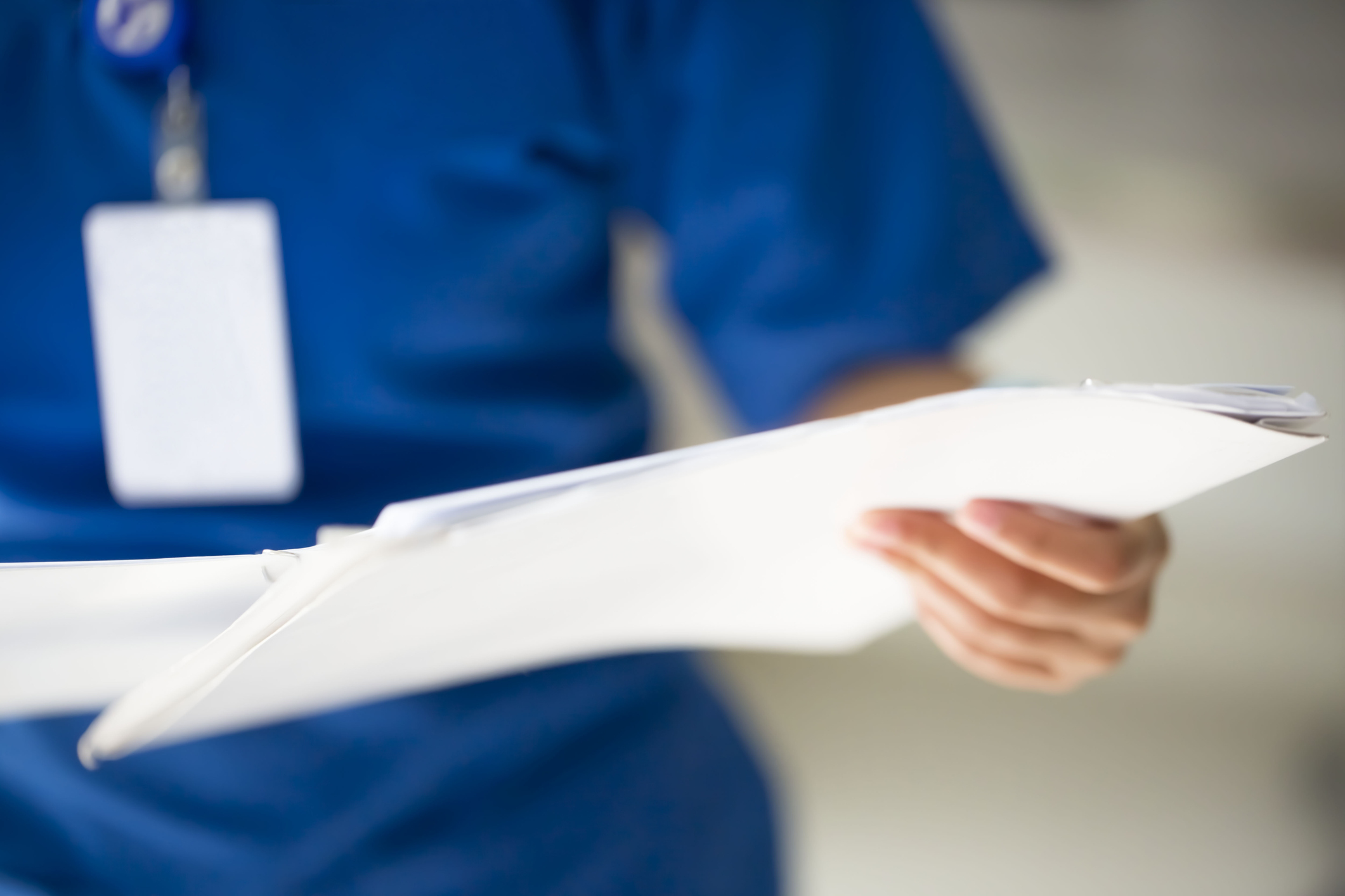 nurse holding paper