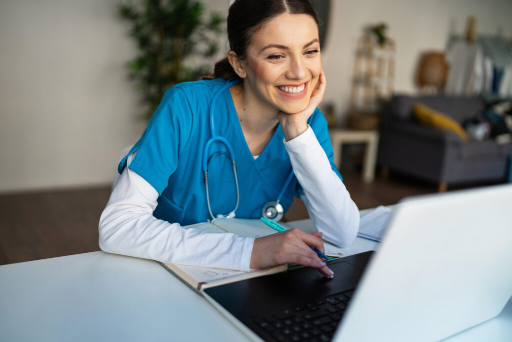 Nurse looking at laptop