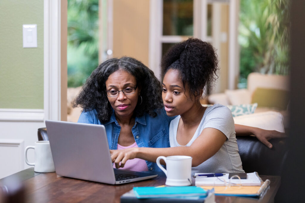 parent helping child with FAFSA