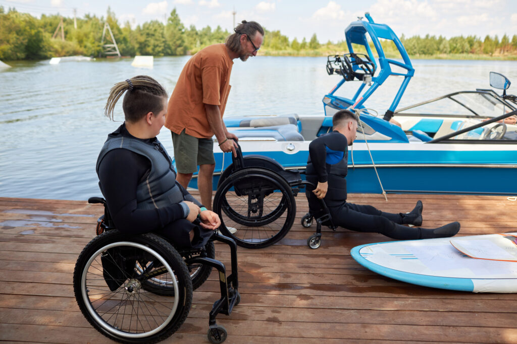 therapist helping man on wheelchair