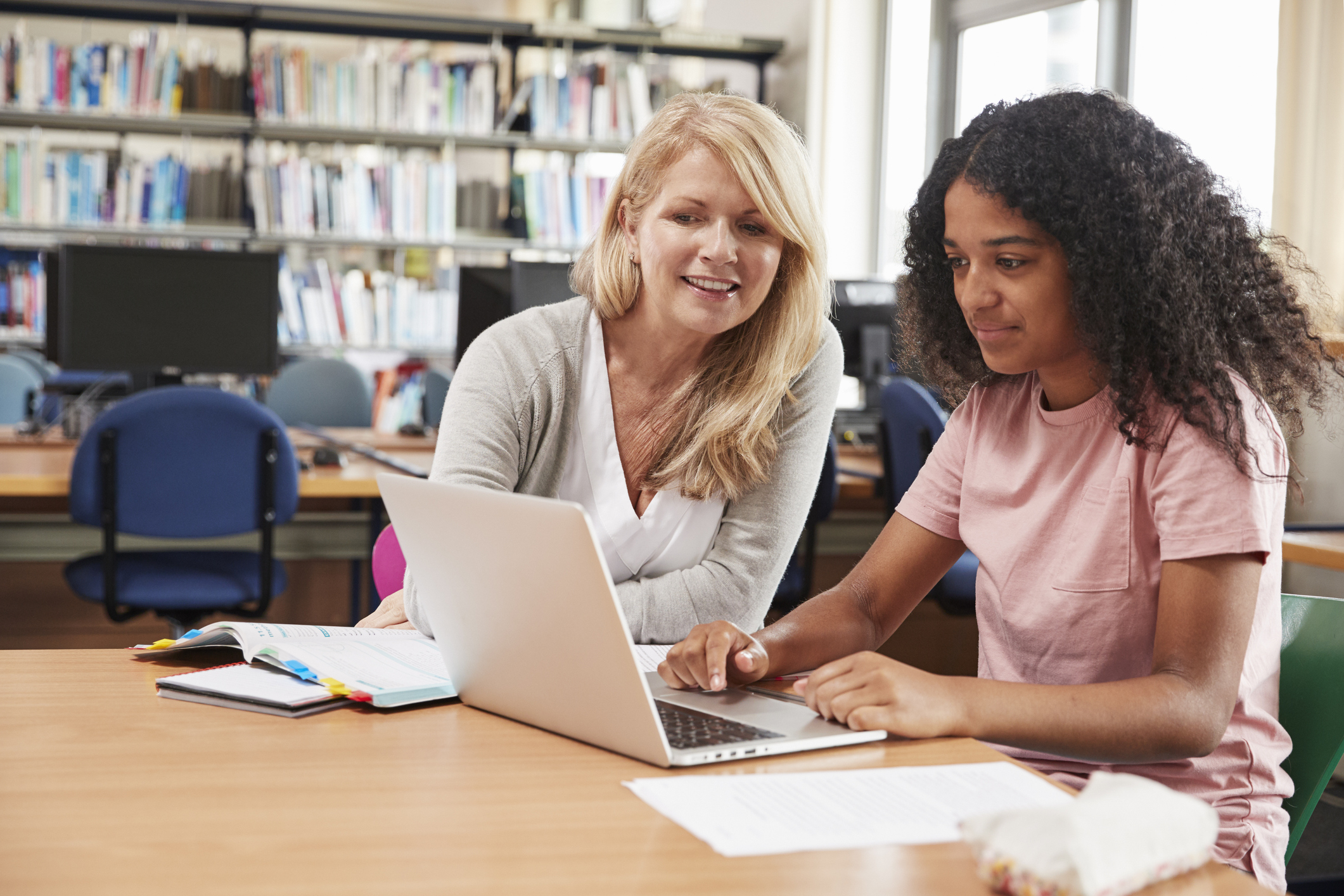 teacher and student with laptop