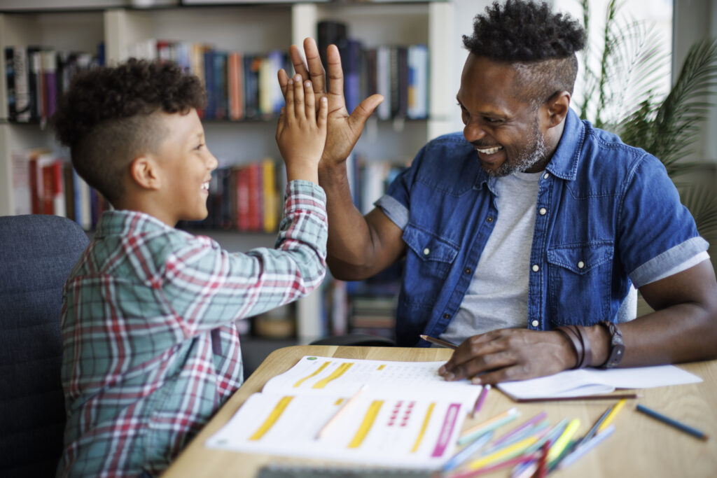 teacher high fiving student
