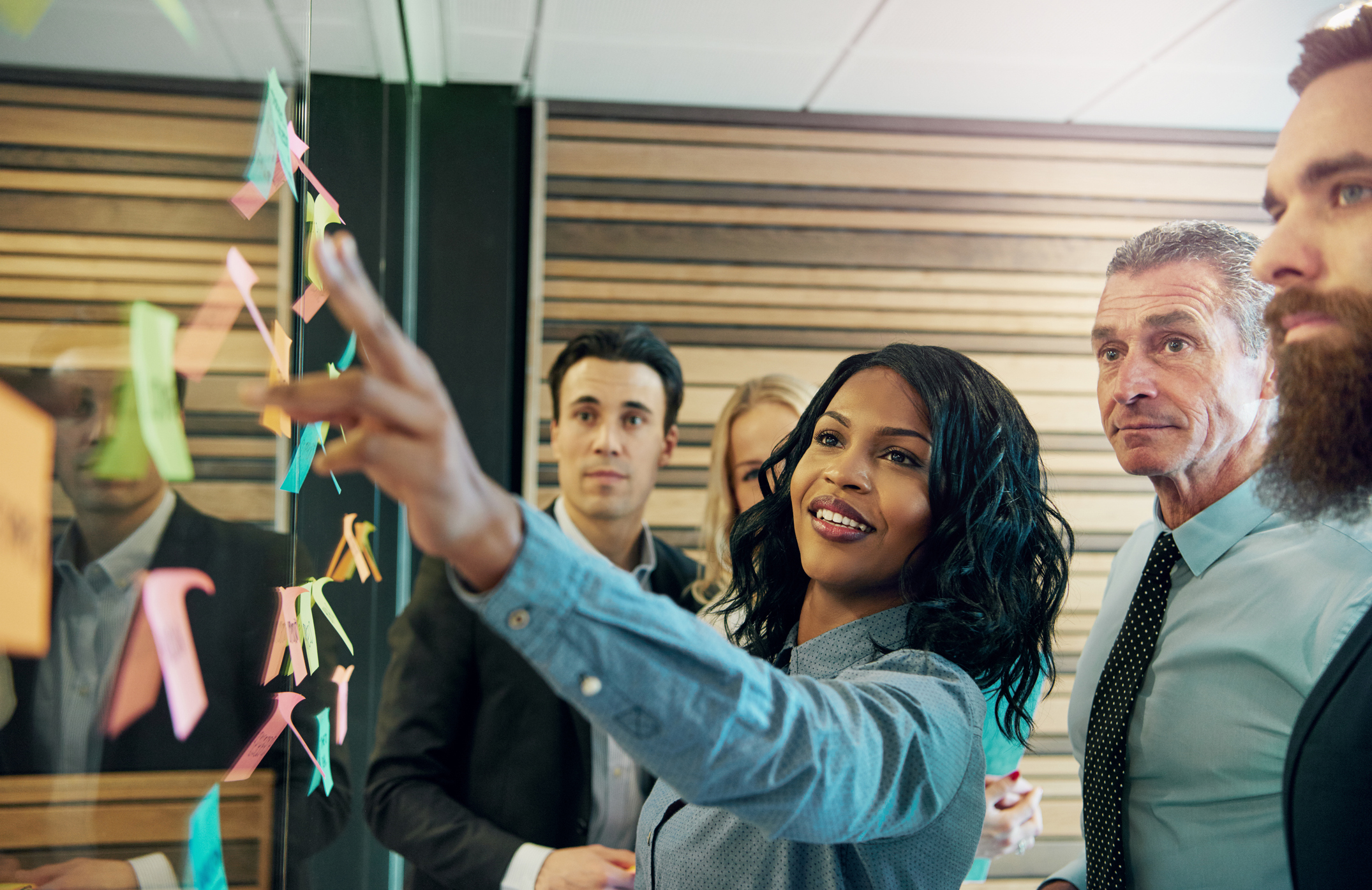 business woman pointing at board